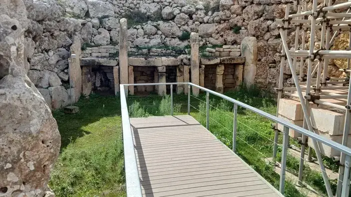 Interior spaces preserve upright slabs, stone-built recesses and evidence of repeated ritual use and alteration.